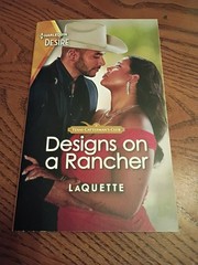 Designs on a Rancher : A Flirty Opposites Attract Romance by LaQuette (2023)